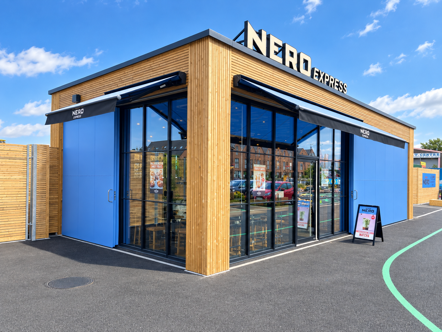 Nero Express café with full-height aluminium-framed glazing