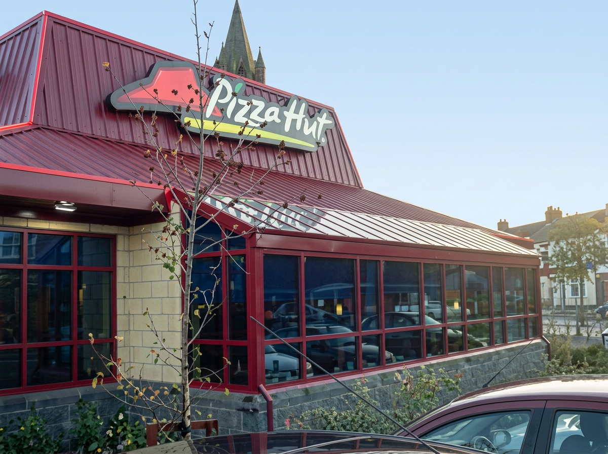 Pizza Hut restaurant with red-framed glazing along its frontage